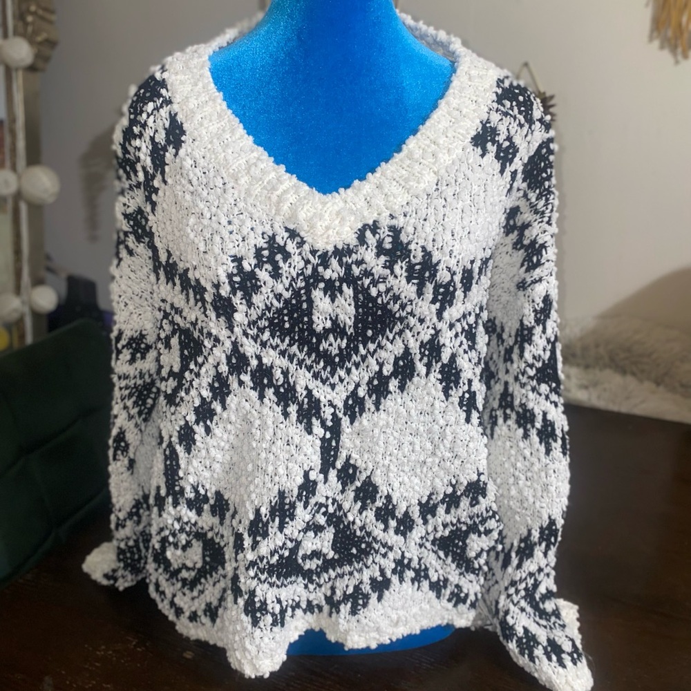 Black and White V-Neck Sweater with Geometric Pattern